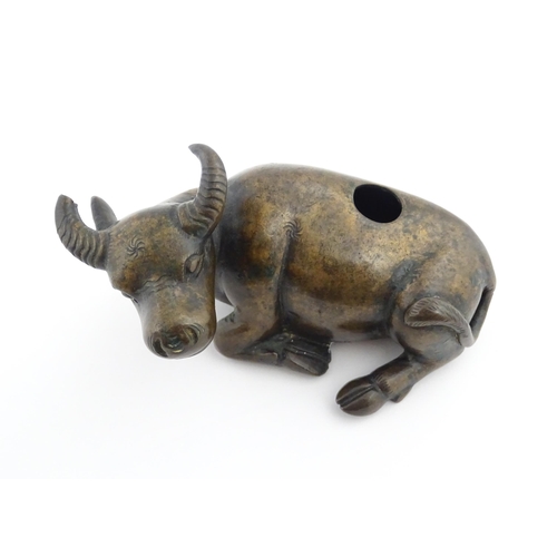 1025 - A Chinese Ming dynasty bronze censer modelled as a recumbent buffalo. Approx. 4 3/4