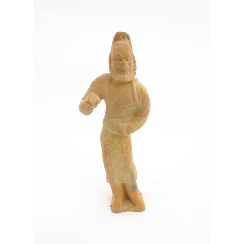 1030 - A Chinese Tang dynasty pottery figure modelled as a horse groom. Approx. 13 1/4