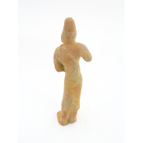 1030 - A Chinese Tang dynasty pottery figure modelled as a horse groom. Approx. 13 1/4