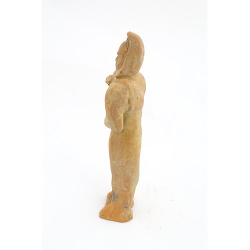 1030 - A Chinese Tang dynasty pottery figure modelled as a horse groom. Approx. 13 1/4