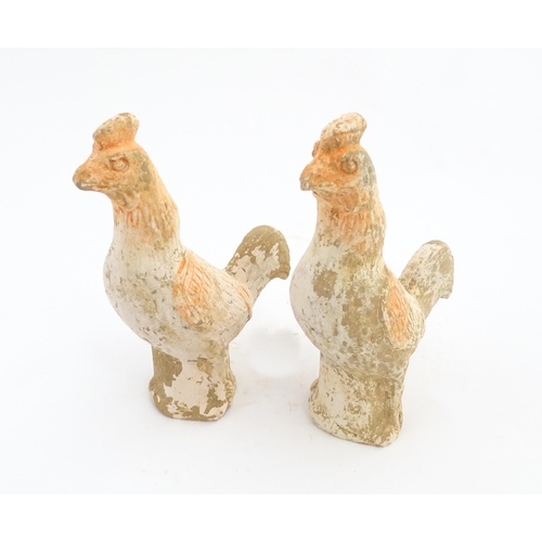 1031 - A pair of Chinese Tang dynasty pottery models of cockerels / roosters. Approx. 6 3/4