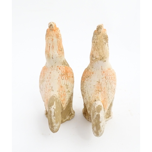 1031 - A pair of Chinese Tang dynasty pottery models of cockerels / roosters. Approx. 6 3/4