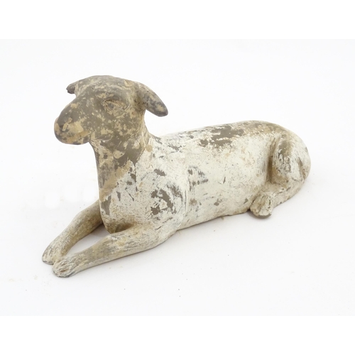 1032 - A Chinese Han dynasty pottery model of a recumbent sheep. Approx. 6 3/4