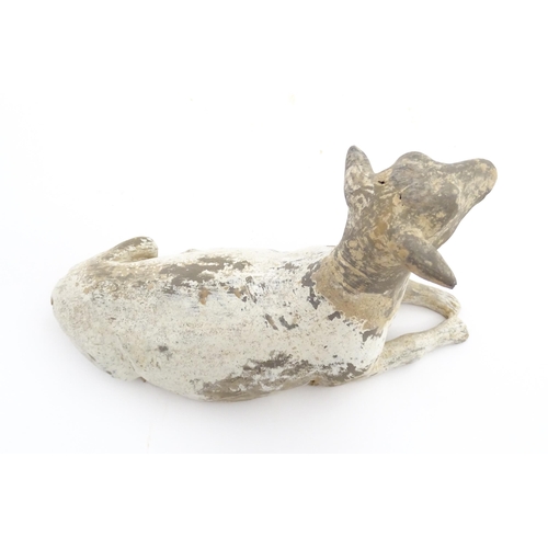 1032 - A Chinese Han dynasty pottery model of a recumbent sheep. Approx. 6 3/4