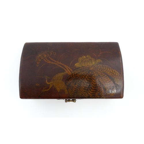 1035 - A Chinese lacquered box with twin handles, the body decorated with cranes and lotus leaves and flowe... 