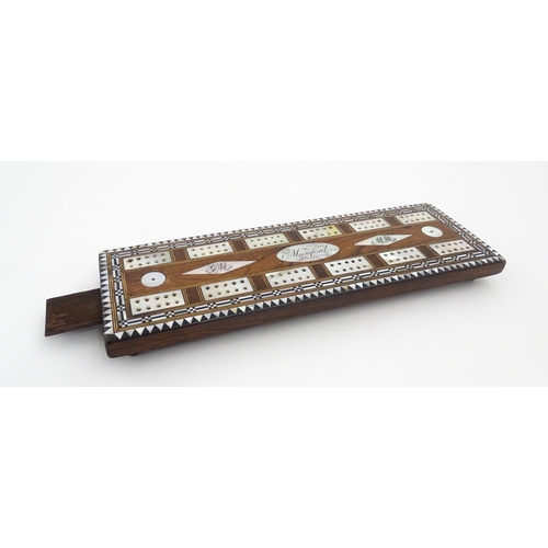 1039 - A late 19th / early 20thC rosewood cribbage board with inlaid mother of pearl decoration. Together w... 