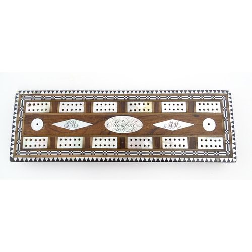 1039 - A late 19th / early 20thC rosewood cribbage board with inlaid mother of pearl decoration. Together w... 