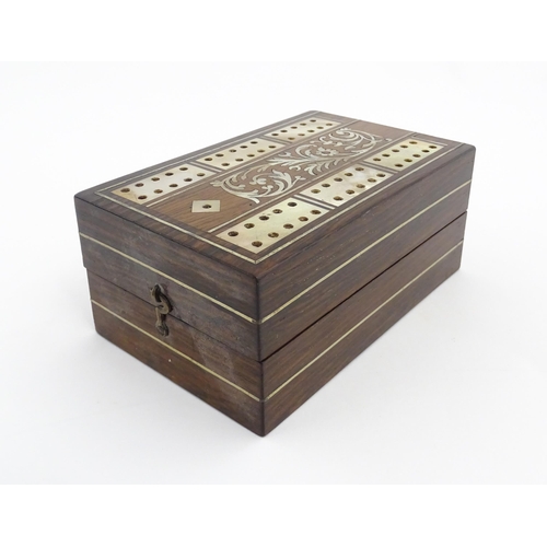 1039 - A late 19th / early 20thC rosewood cribbage board with inlaid mother of pearl decoration. Together w... 