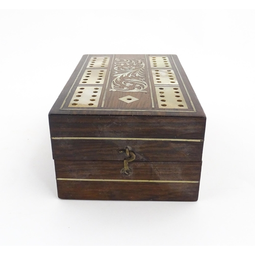 1039 - A late 19th / early 20thC rosewood cribbage board with inlaid mother of pearl decoration. Together w... 