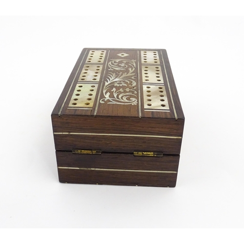 1039 - A late 19th / early 20thC rosewood cribbage board with inlaid mother of pearl decoration. Together w... 