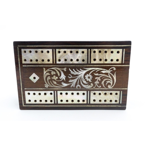 1039 - A late 19th / early 20thC rosewood cribbage board with inlaid mother of pearl decoration. Together w... 