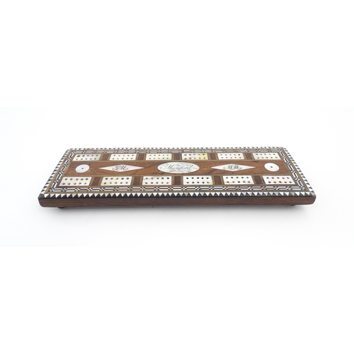 1039 - A late 19th / early 20thC rosewood cribbage board with inlaid mother of pearl decoration. Together w... 