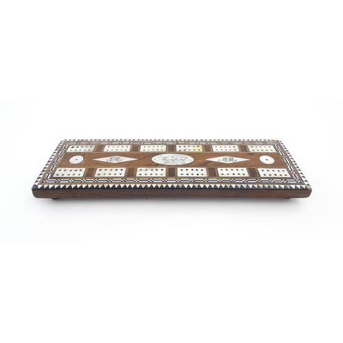 1039 - A late 19th / early 20thC rosewood cribbage board with inlaid mother of pearl decoration. Together w... 