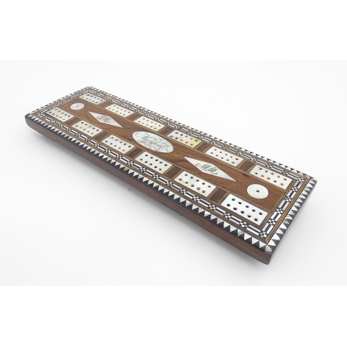 1039 - A late 19th / early 20thC rosewood cribbage board with inlaid mother of pearl decoration. Together w... 