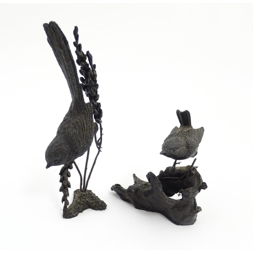 1043 - Two 20thC cast bronze ornithological / bird studies comprising a model of a wren perched on an old b... 