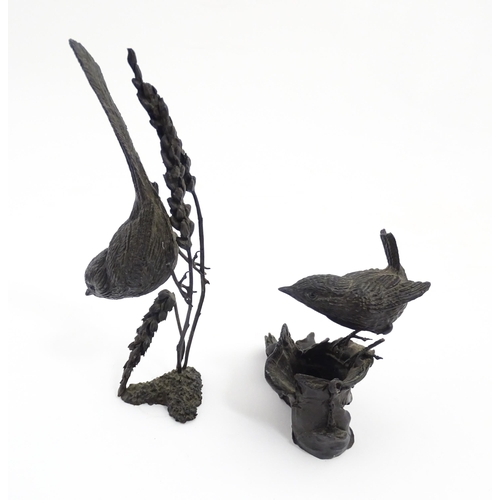 1043 - Two 20thC cast bronze ornithological / bird studies comprising a model of a wren perched on an old b... 