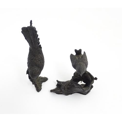 1043 - Two 20thC cast bronze ornithological / bird studies comprising a model of a wren perched on an old b... 