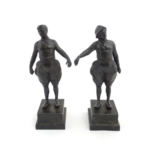 1050 - Two 20thC Continental cast figures modelled as traditional Dutch fishermen. Approx. 10