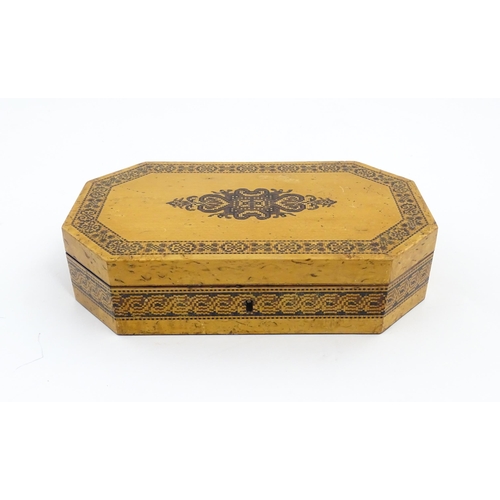 1062 - A 19thC Tunbridge ware games box of octagonal form with banded decoration, opening to reveal four se... 