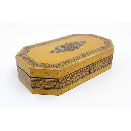 1062 - A 19thC Tunbridge ware games box of octagonal form with banded decoration, opening to reveal four se... 