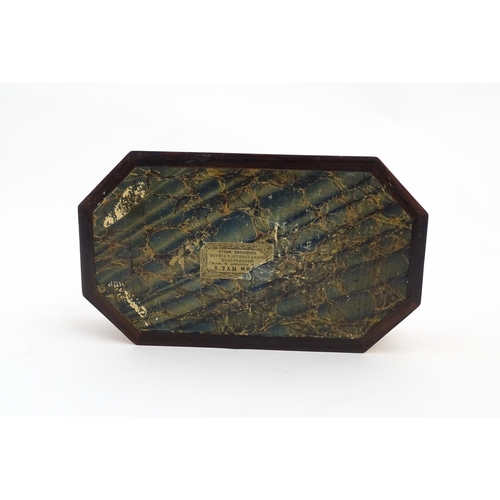 1062 - A 19thC Tunbridge ware games box of octagonal form with banded decoration, opening to reveal four se... 