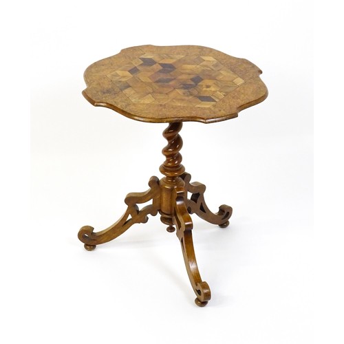 1572 - A 19thC tripod table with a burr amboyna veneered top surrounding a central parquetry style sample w... 