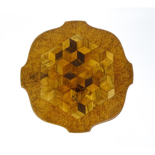 1572 - A 19thC tripod table with a burr amboyna veneered top surrounding a central parquetry style sample w... 