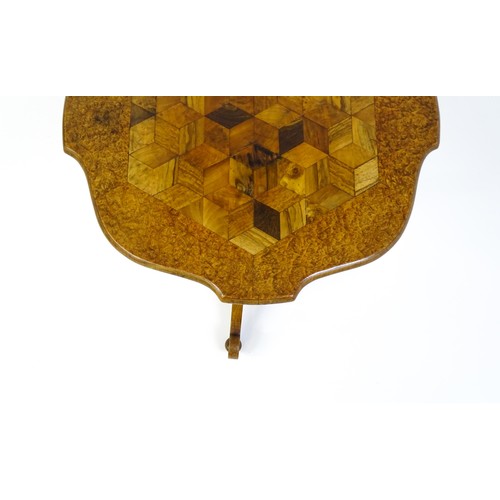 1572 - A 19thC tripod table with a burr amboyna veneered top surrounding a central parquetry style sample w... 