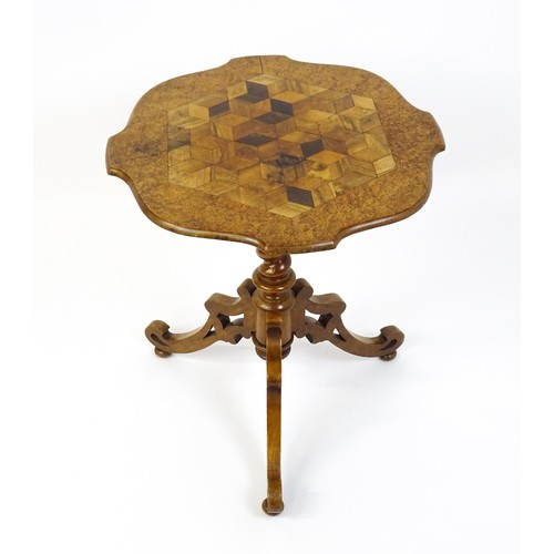 1572 - A 19thC tripod table with a burr amboyna veneered top surrounding a central parquetry style sample w... 