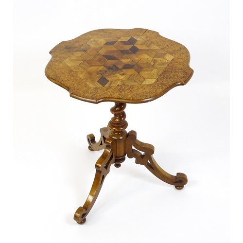 1572 - A 19thC tripod table with a burr amboyna veneered top surrounding a central parquetry style sample w... 