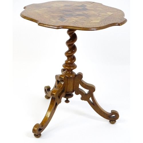 1572 - A 19thC tripod table with a burr amboyna veneered top surrounding a central parquetry style sample w... 