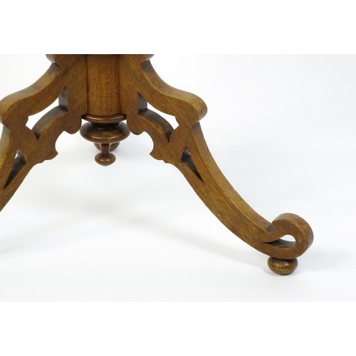 1572 - A 19thC tripod table with a burr amboyna veneered top surrounding a central parquetry style sample w... 