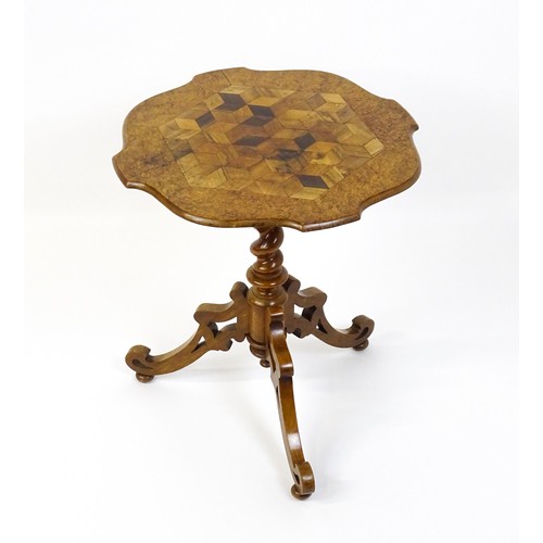 1572 - A 19thC tripod table with a burr amboyna veneered top surrounding a central parquetry style sample w... 