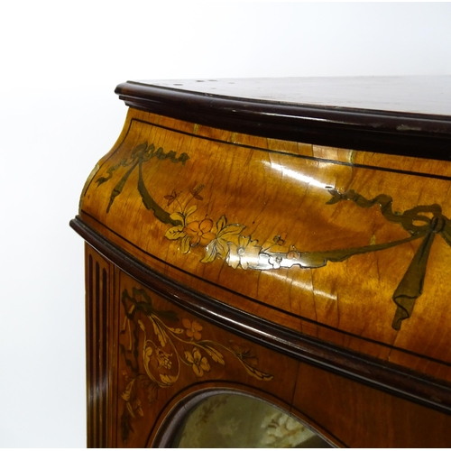 1574 - A late 19thC satinwood bookcase with a profusely inlaid frame with satinwood, box wood and fruit woo... 