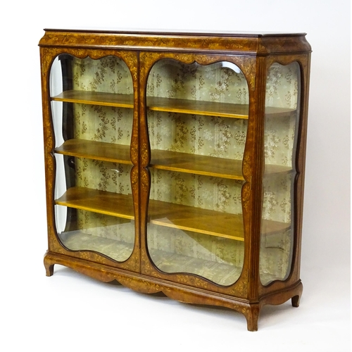 1574 - A late 19thC satinwood bookcase with a profusely inlaid frame with satinwood, box wood and fruit woo... 