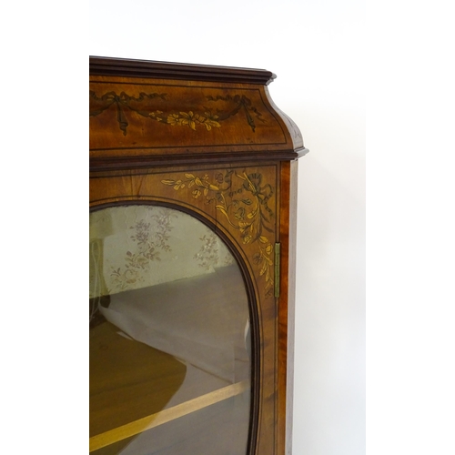 1574 - A late 19thC satinwood bookcase with a profusely inlaid frame with satinwood, box wood and fruit woo... 