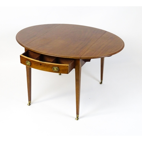 1577 - An early 19thC mahogany Pembroke table with a satinwood strung top above a single frieze drawer rais... 