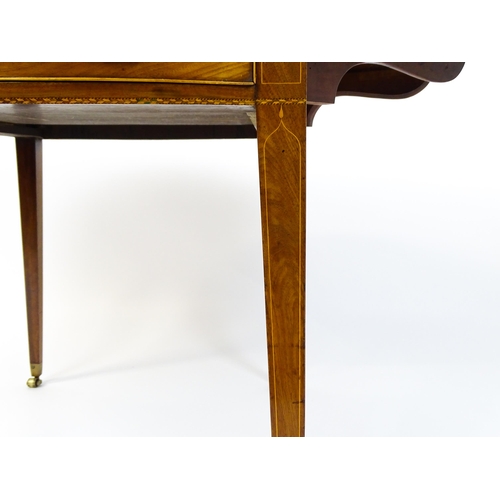 1577 - An early 19thC mahogany Pembroke table with a satinwood strung top above a single frieze drawer rais... 