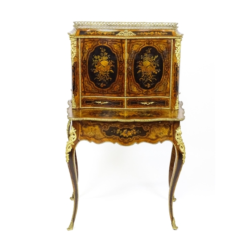 1582 - A 19thC kingwood Bonheur du jour surmounted by a brass gallery and having a profusely inlaid frame, ... 