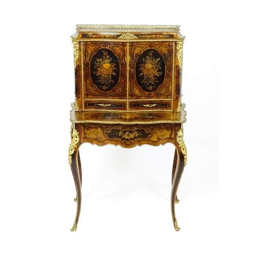 1582 - A 19thC kingwood Bonheur du jour surmounted by a brass gallery and having a profusely inlaid frame, ... 