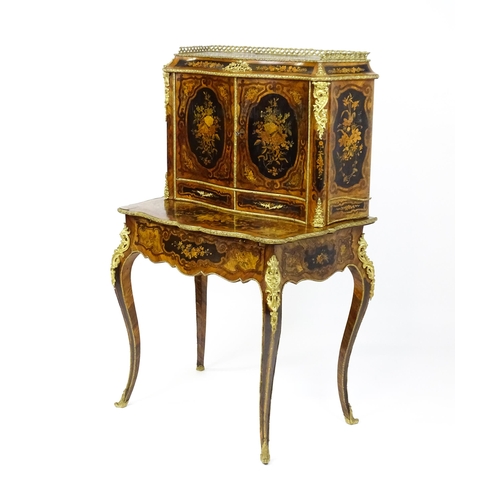 1582 - A 19thC kingwood Bonheur du jour surmounted by a brass gallery and having a profusely inlaid frame, ... 