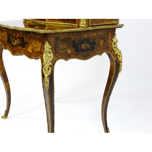 1582 - A 19thC kingwood Bonheur du jour surmounted by a brass gallery and having a profusely inlaid frame, ... 