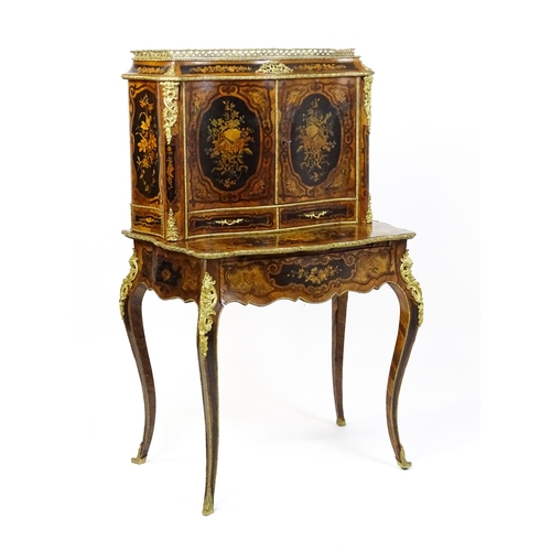 1582 - A 19thC kingwood Bonheur du jour surmounted by a brass gallery and having a profusely inlaid frame, ... 