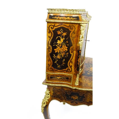 1582 - A 19thC kingwood Bonheur du jour surmounted by a brass gallery and having a profusely inlaid frame, ... 