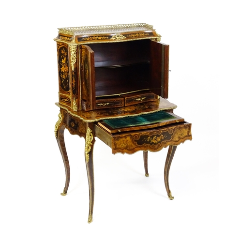 1582 - A 19thC kingwood Bonheur du jour surmounted by a brass gallery and having a profusely inlaid frame, ... 