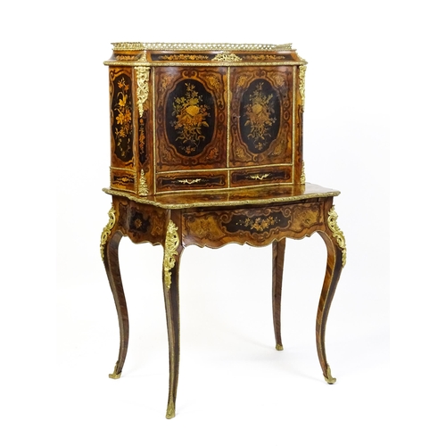 1582 - A 19thC kingwood Bonheur du jour surmounted by a brass gallery and having a profusely inlaid frame, ... 