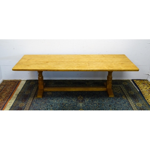 1583 - A mid to late 20thC Robert 'Mouseman' Thompson dining table. The 8ft long oak table top with an adze... 