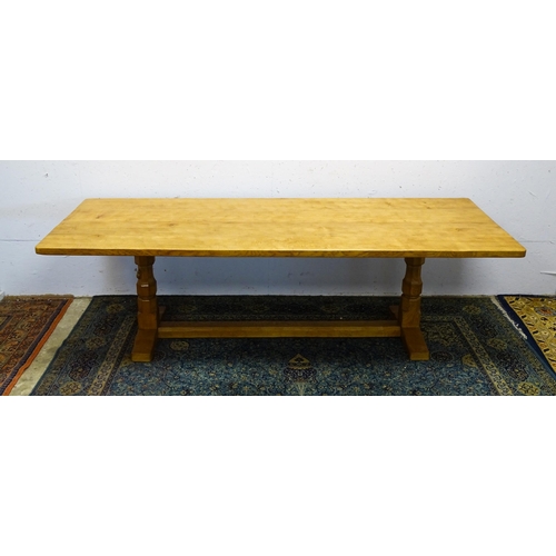 1583 - A mid to late 20thC Robert 'Mouseman' Thompson dining table. The 8ft long oak table top with an adze... 