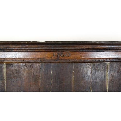 1591 - A mid 18thC oak dresser with a moulded cornice above three graduated shelves flanked by panelled cup... 