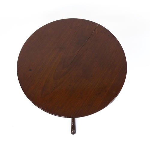 1594 - A 19thC mahogany tripod table with a turned pedestal above three cabriole legs. 27